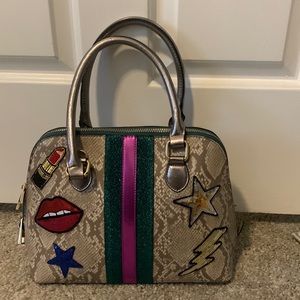 Aldo Satchel Bag with Lipstick and Star Appliqués